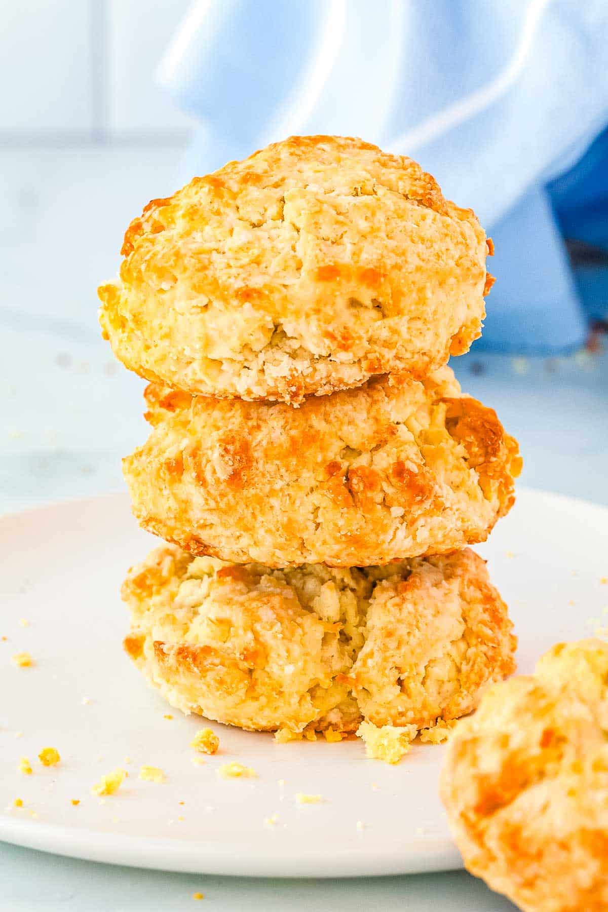 Three buttermilk drop biscuits stacked on top of each other.