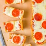 Cut up slices of French Bread Pizza.