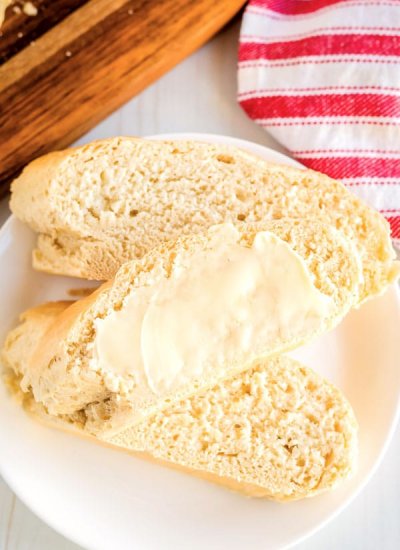 French bread slices with butter spread on them.