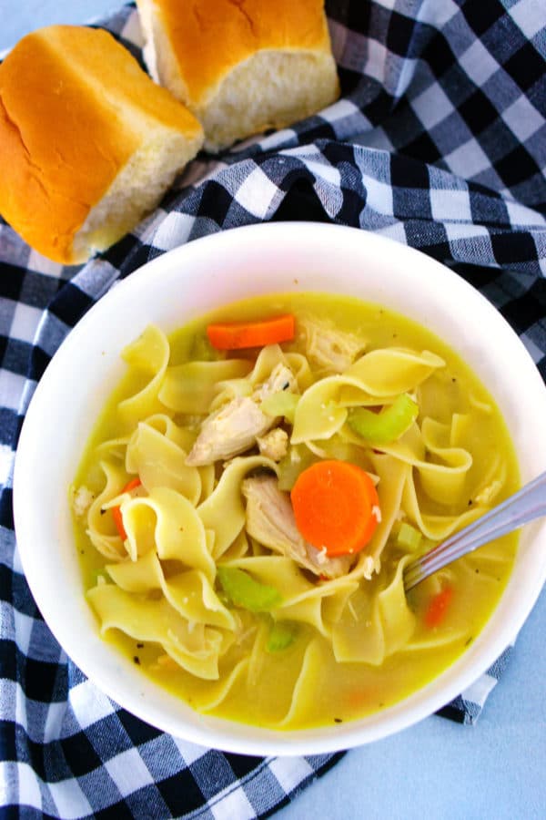 Overhead picture of chicken noodle soup in a bowl with a spoon ready for eating!