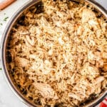 An overhead picture of shredded chicken in an Instant Pot insert.