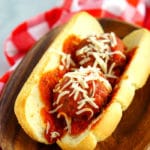Close up picture of a meatball sub sandwich on a butter roll.