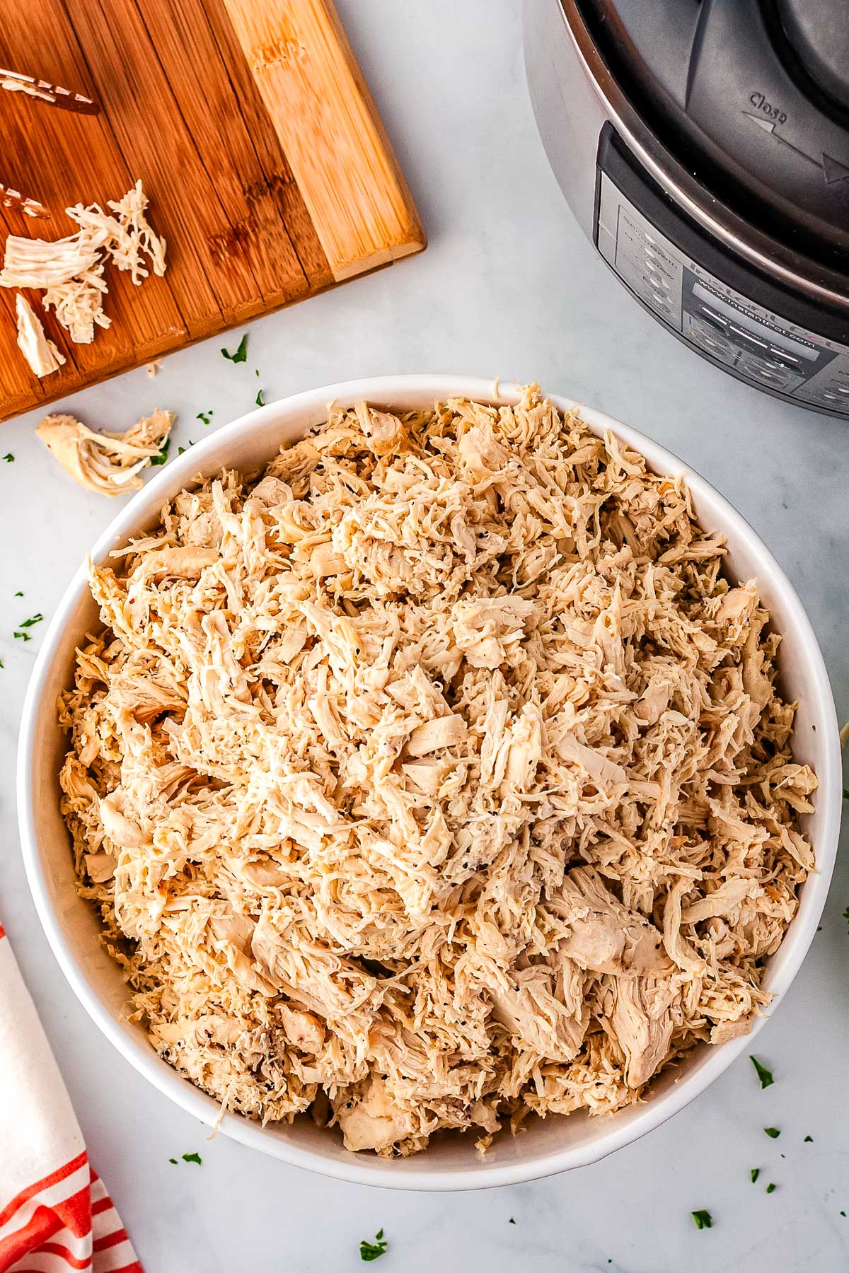 A bowl full of Instant Pot Shredded Chicken. 