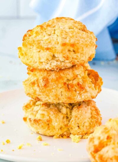 Three buttermilk drop biscuits stacked on top of each other.