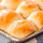 A close up of the 1 hour dinner rolls in a rimmed baking dish.
