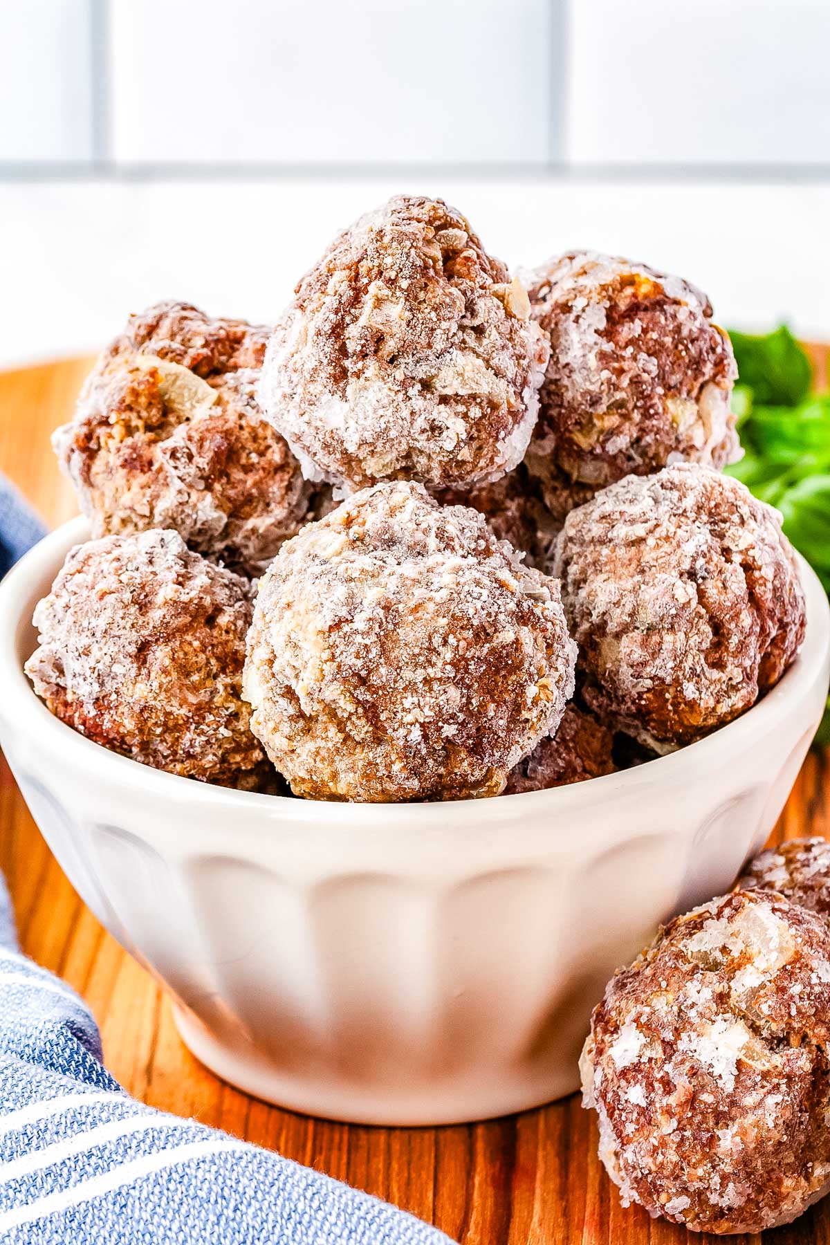 Freezer meatballs in a white bowl. 