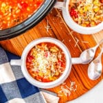 Italian soup with zucchini in a white bowl.