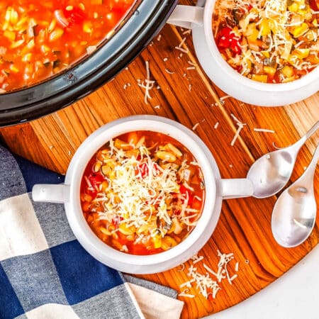 Italian soup with zucchini in a white bowl.