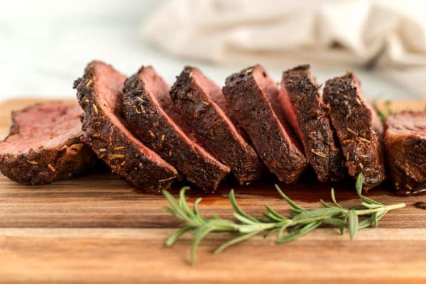 Sliced of sliced roast on a cutting board.