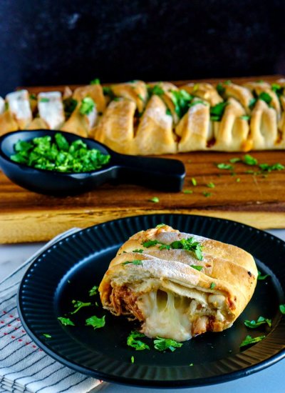 A slice of chicken braid on a black plaid.