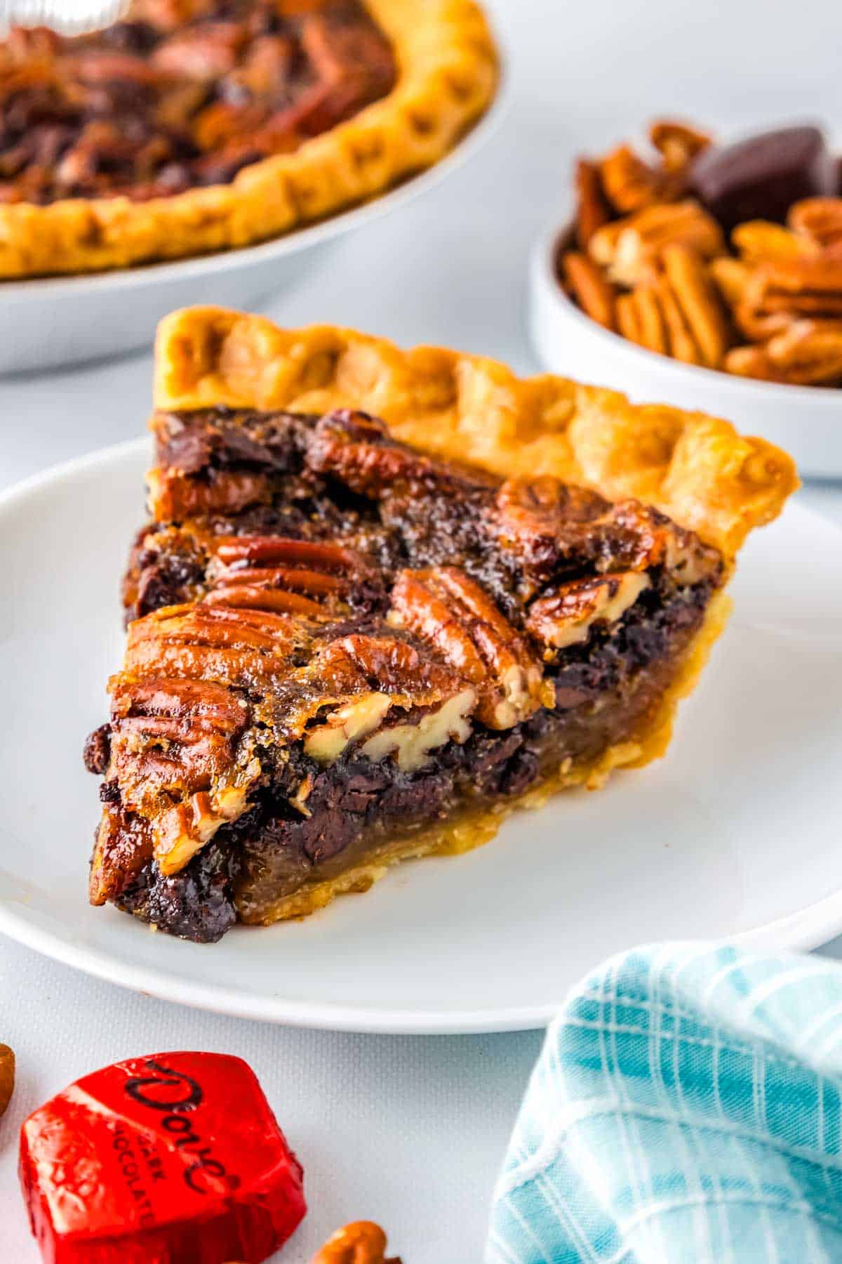 A slice of pie on a white plate.