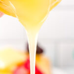pancake syrup being poured out of a bottle
