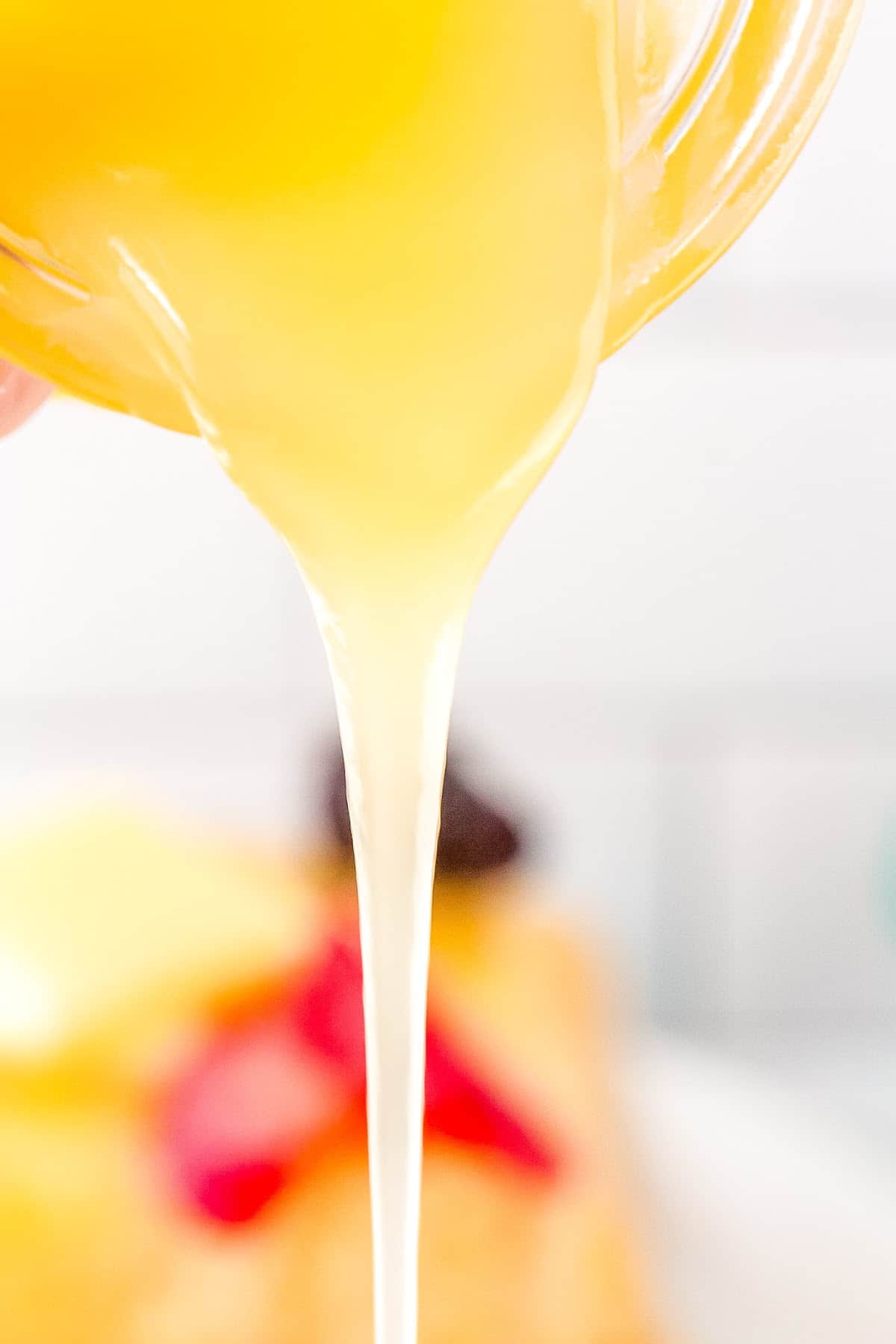 pancake syrup being poured out of a bottle