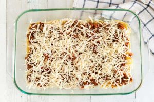 Layer with spaghetti, meat sauce, cottage cheese, and mozzarella.