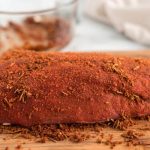 Rub the beef on all sides with the rub and let it sit at room temperature for 20-30 minutes.