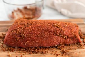 Rub the beef on all sides with the rub and let it sit at room temperature for 20-30 minutes.