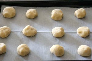 Roll the dough into granulated sugar.
