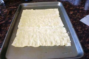 Stretch the dough out into a rectangle.