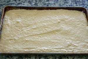 Pour the batter into a greased rimmed sheet pan.