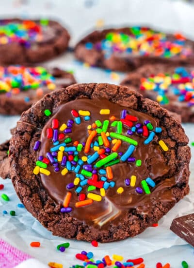 brownie cookie with sprinkles with more cookies in the background