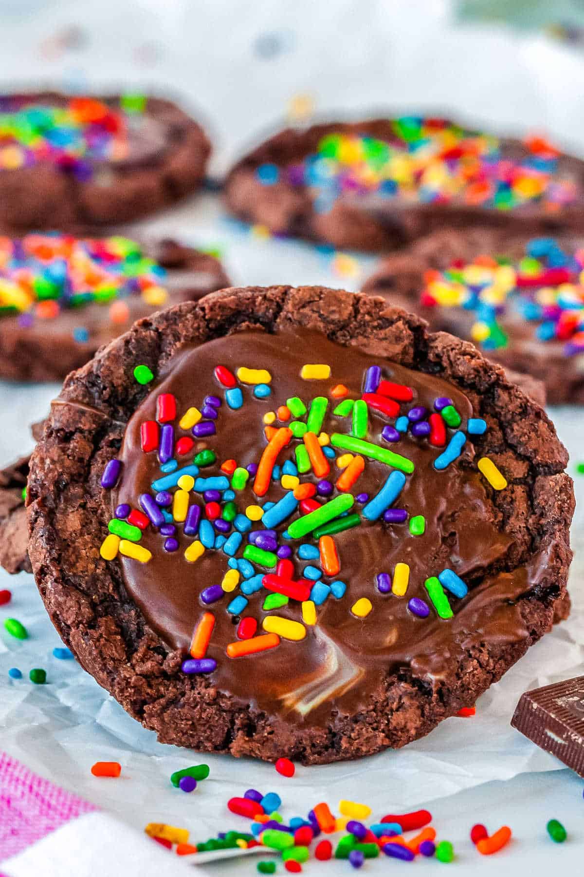 up close shot of the cookie with sprinkles and more cookies in the background