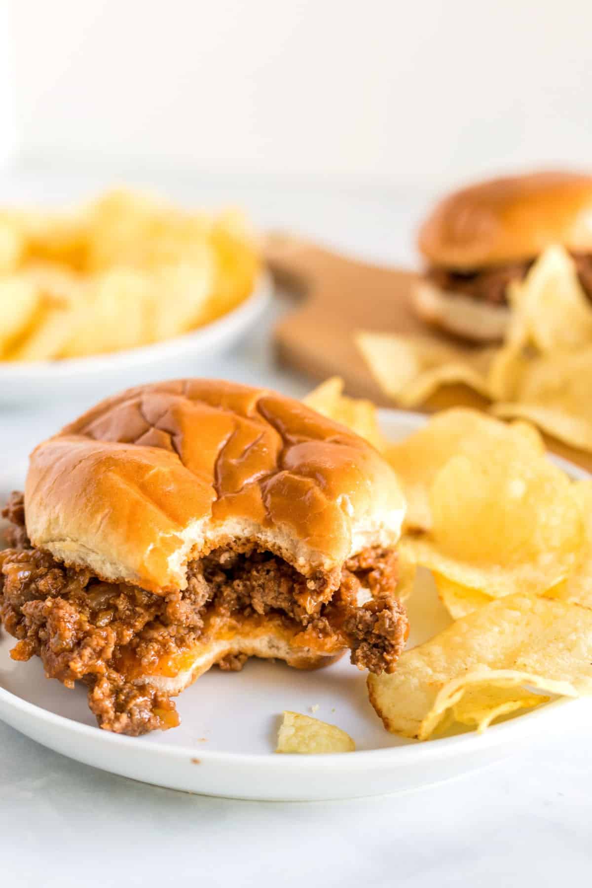 sloppy joe on a plate with a bite taken out of it