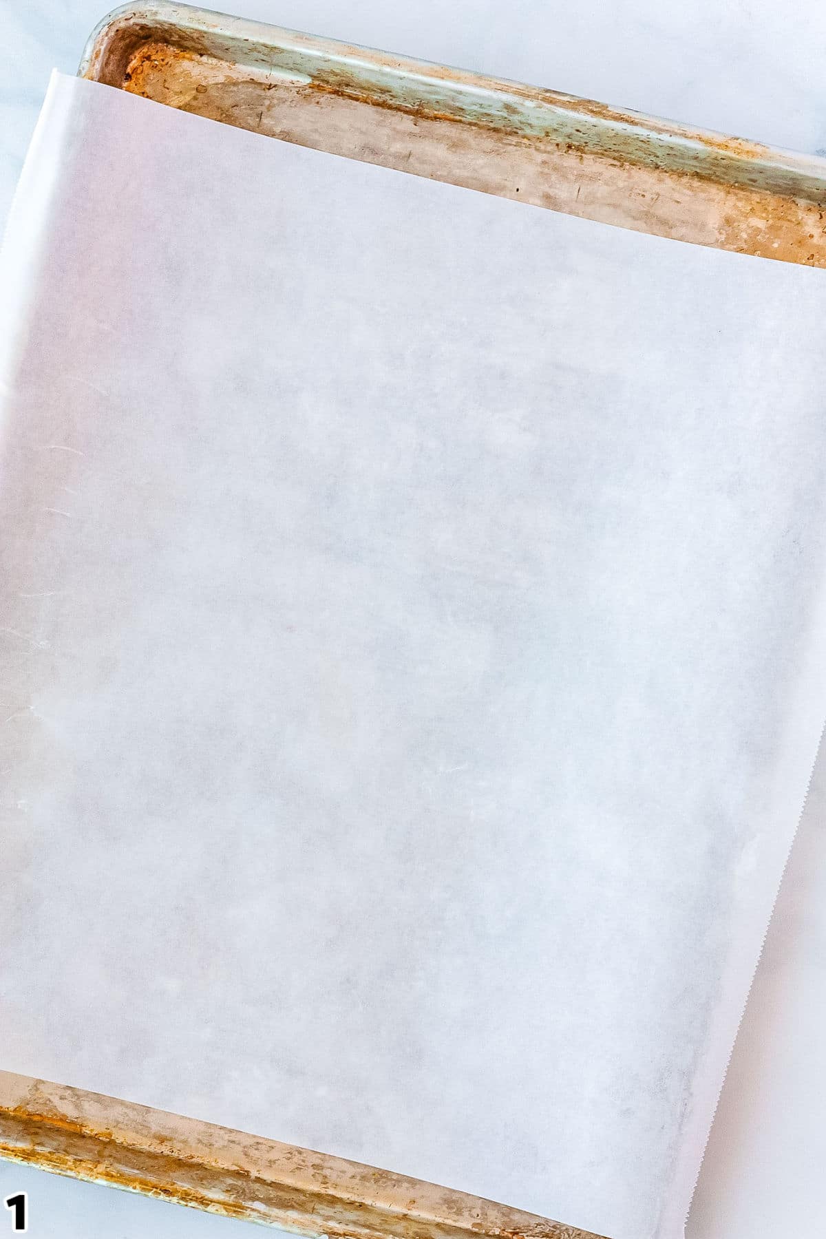 A bakig sheet lined with parchment paper.