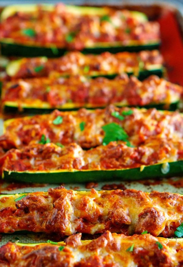 Close up of zucchini stuffed with turkey meat sauce.