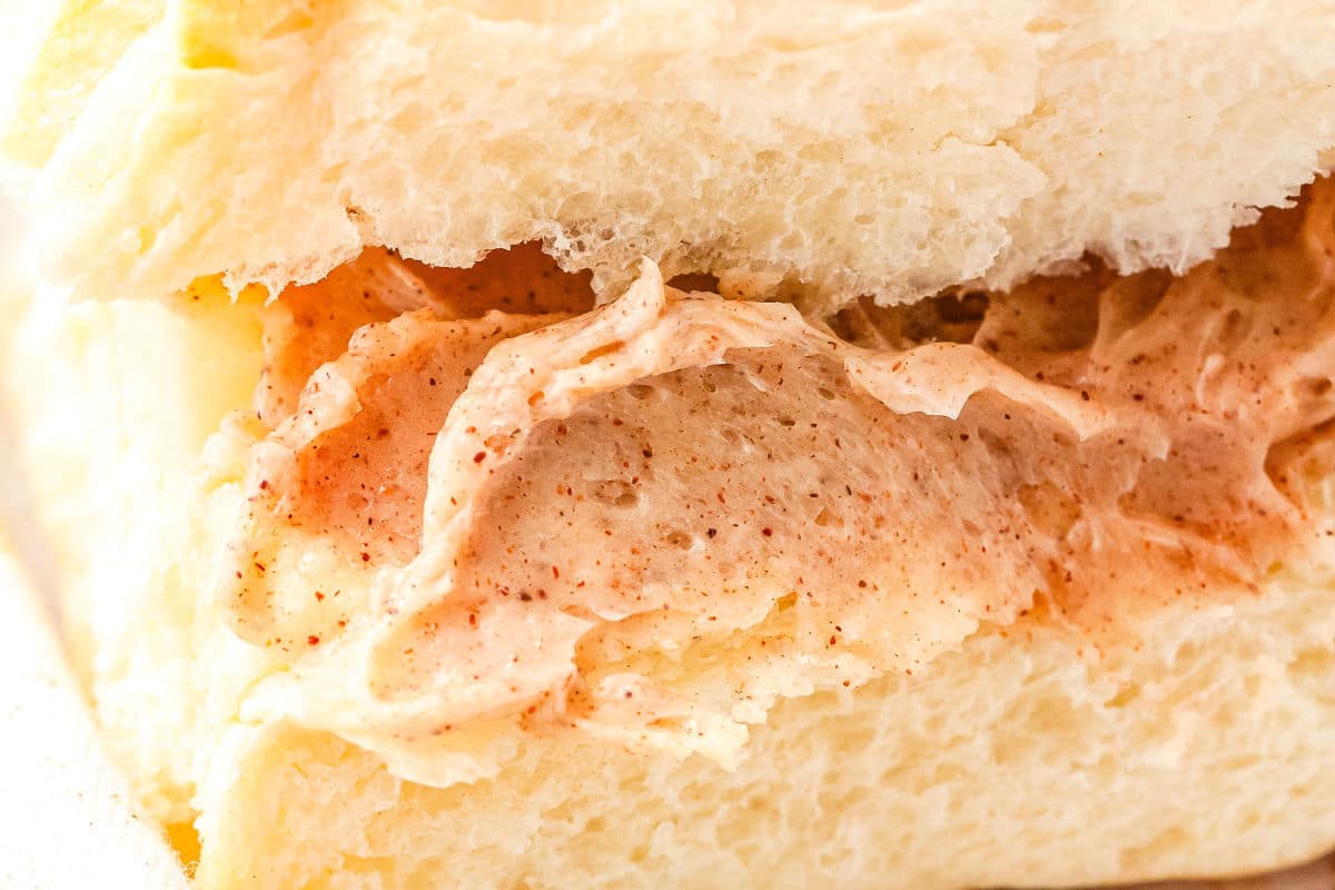 a closeup of cinnamon honey butter on a roll