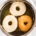 Fry the donuts until golden on both sides.