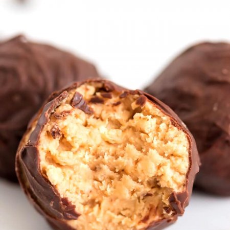 Close up picture of a bite taken out of a bon bon.