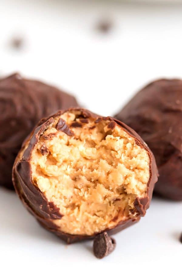 Close up picture of a bite taken out of a bon bon.