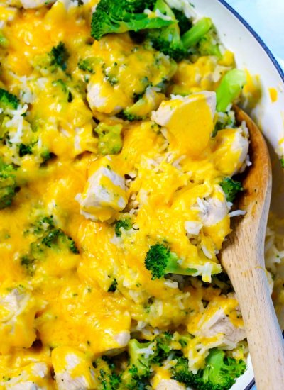 A serving spoon in the cheesy rice.