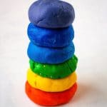 Balls of Homemade playdough stacked on top of each other.