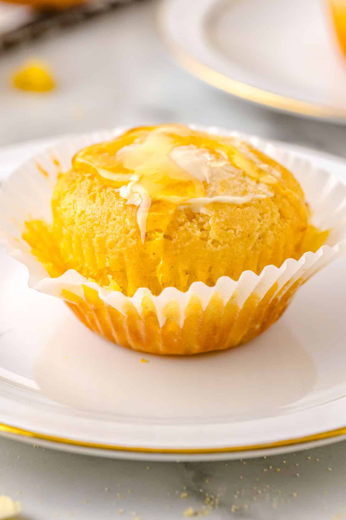 Butter and honey on a corn muffin.