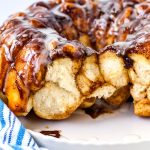 Close up picture of monkey bread showing it's interior because some pieces have been torn away.