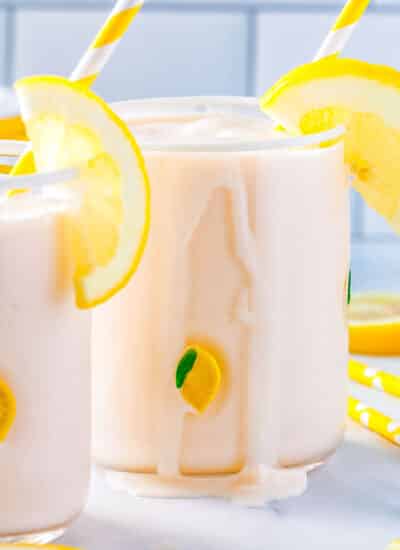 The Frozen Lemonade poured into two clear glases with a little of the mixture dribbling down the side of the glass.