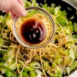 Add in the soy sauce and oyster sauce and toss to coat the vegetables and noodles.