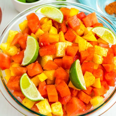 An overhead picture of the finished Mexican Fruit Salad in a clear glass bowl.
