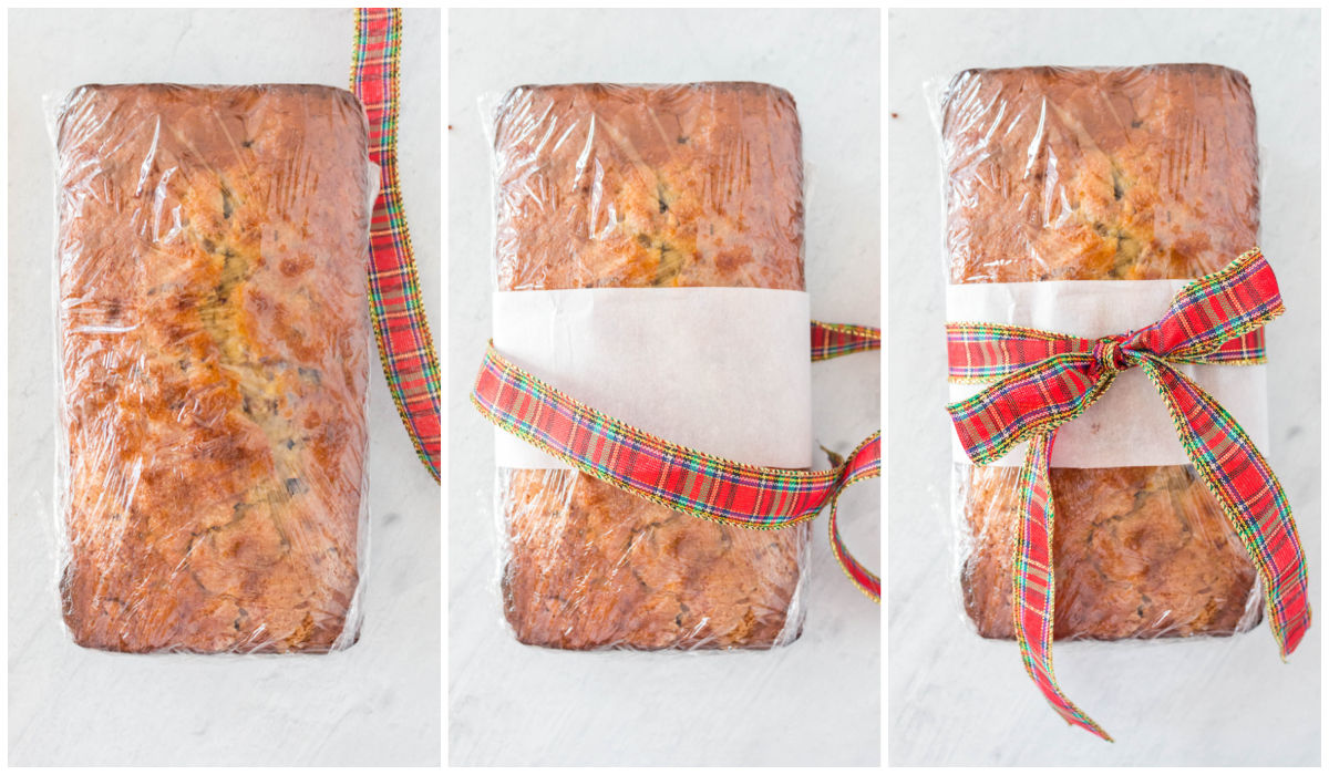 The finished cake mix banana bread being wrapped with plastic wrap and a ribbon for neighbor gifts.