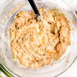 Mix together cream of celery soup, cheese, and green onions.