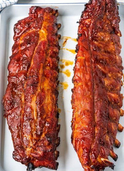 Overhead of 2 racks of spare ribs that just came off of the grill.