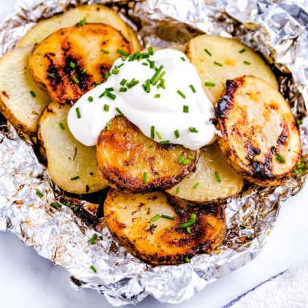 Close up picture of the finished grilled potatoes in foil.