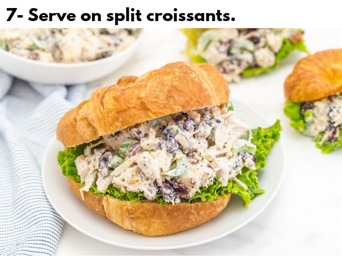 Chicken salad on a split croissant with lettuce.