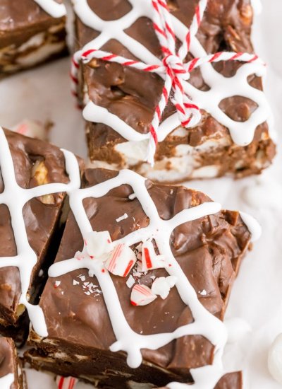 A close up picture of slices of fudge that are drizzles with marshmallow.