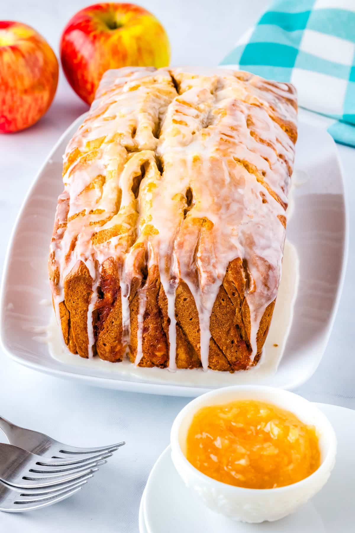 Apple pie bread on a white serving plate.