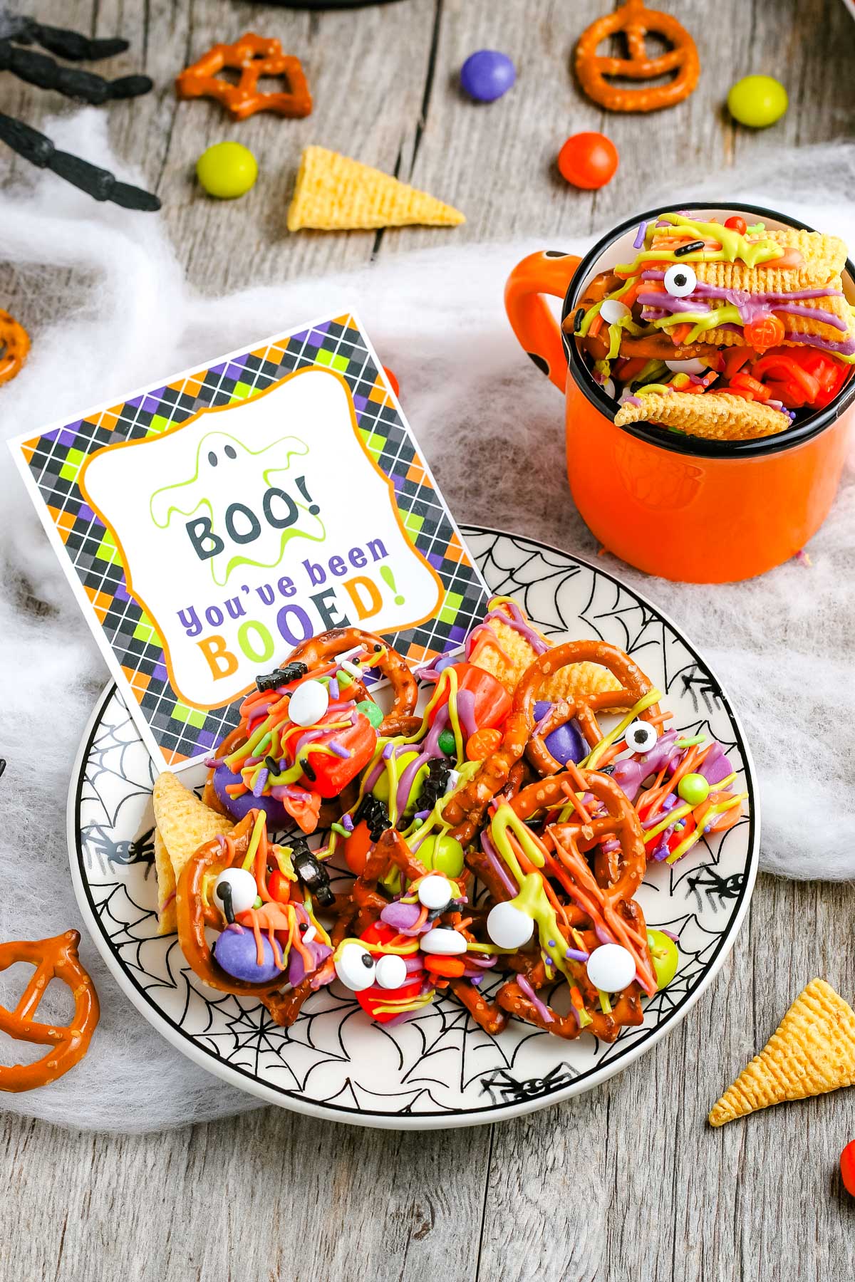 A plate of snack mix with a gifting tag on it.