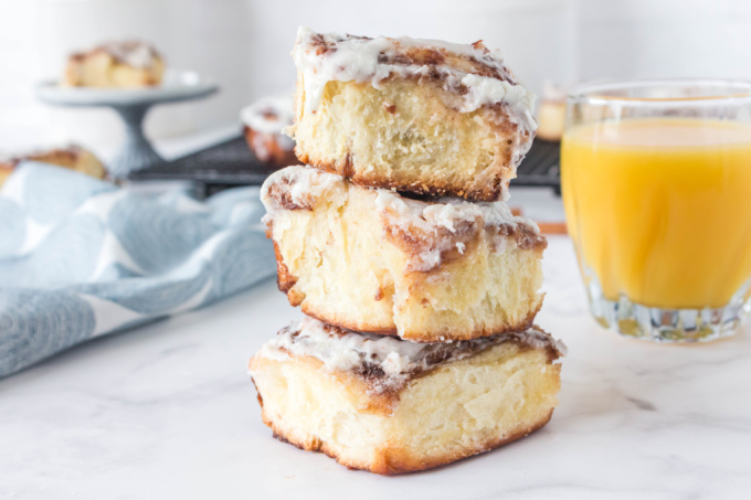 Three Overnight Cinnamon Rolls stacked on top of each other.