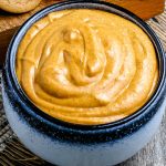 A close up picture of a pot full of Pumpkin Cream Cheese Dip.