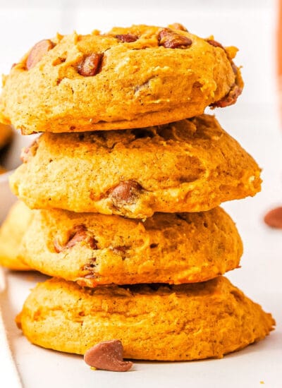 a stack of pumpkin chocolate chip cookies